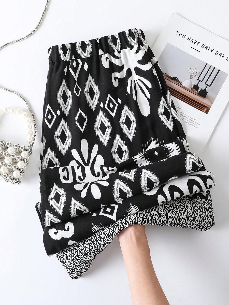 SHEIN LUNE Pantalones casuales con elástico en la cintura y estampado para mujeres de tallas grandes - Negro - Ver 1