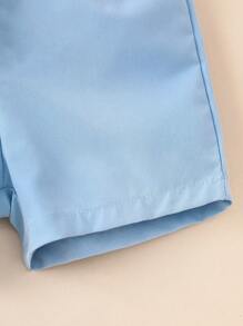 SHEIN Conjunto de camisa de manga corta a rayas y shorts para bebé niño