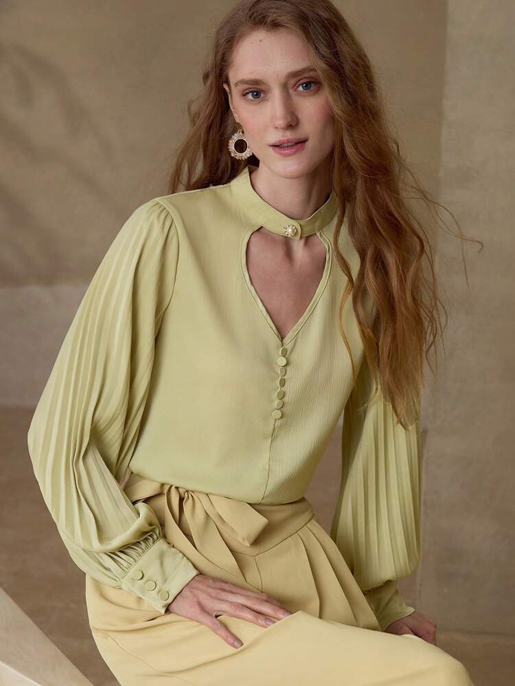 PLEATED SLEEVE CUT OUT BLOUSE