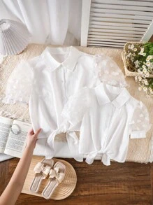 Girls' White Blouse With Ruffle Sleeves, Featuring Textured Fabric That Adds Unique Tactile Quality And Depth To The Design. This Versatile Shirt Can Be Worn To School, Casual Outings, Or More Formal Occasions, Paired With Skirts Or Pants To Showcase A Youthful And Energetic Look - White - View 1