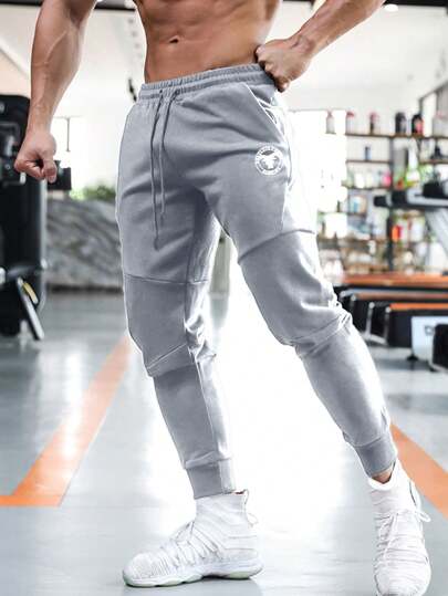 Manfinity Sport Corelite 男友风男士抽绳牛角图案弹力裤脚运动休闲户外裤校园运动裤