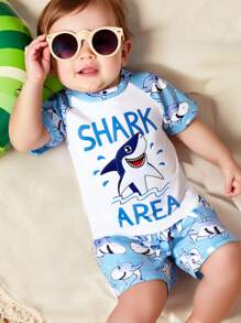 Toddler Boys' 1-3 Years Old Fashion Swimwear Set. Shark Print Sports Outfit. White Top With Light Blue Sleeves And Blue Shark Printed Shorts Set, Bright Colors, Suitable For Baby Boy's First Beach Trip And Swimming, Stretchy Fabric For Easy Movement, Perfect For Toddlers, Fashionable And Adorable Beach Look Boy Clothes For Kids Baby Boys Sets Baby Boy Beach Wear Toddler Beach Wear Boy Clothes For Baby Baby Boys Clothing Summer