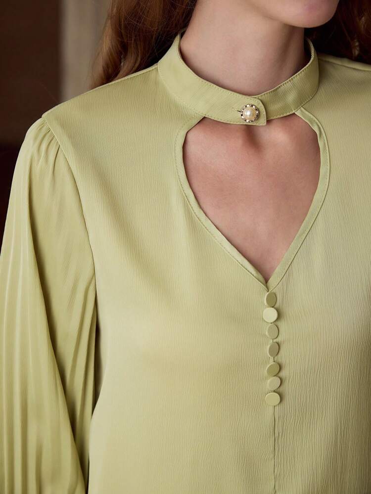 PLEATED SLEEVE CUT OUT BLOUSE