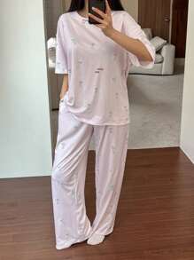 DAZY Conjunto de pijama de 2 piezas para mujer con camiseta holgada estampada con diseño lindo de perro y pantalón recto