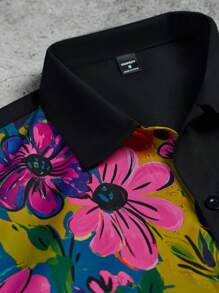 Manfinity Hypemode Camisa casual de manga corta negra con estampado floral y grafiti colorido en la parte delantera para hombres