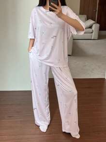 DAZY Conjunto de pijama de 2 piezas para mujer con camiseta holgada estampada con diseño lindo de perro y pantalón recto