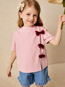 SHEIN Camiseta de cuello redondo para niñas jóvenes y elegante con decoración de lazo rosa, primavera/verano - Rosa - Ver 1
