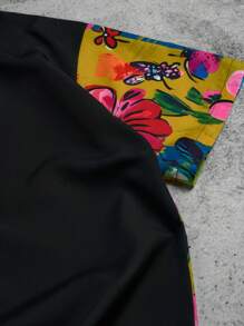 Manfinity Hypemode Camisa casual de manga corta negra con estampado floral y grafiti colorido en la parte delantera para hombres