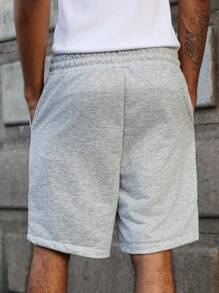 Manfinity Streetrush Pantalones cortos con cordón en la cintura y estampado de estrella de cinco puntas con cinta a rayas para hombres