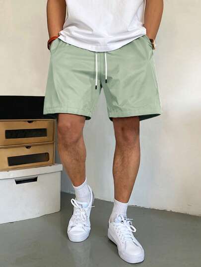 Manfinity Homme Pantalones cortos holgados para hombre con bolsillos en diagonal y cintura con cordón