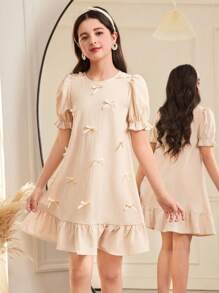 SHEIN Vestido informal holgado para niñas preadolescentes con cuello redondo, manga corta abullonada, volantes, empalme y decoración de lazo 3D, estilo minimalista elegante de color liso