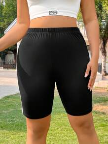 SHEIN EZwear Pantaloncini casual neri a righe con elastico in vita, per donne taglie forti