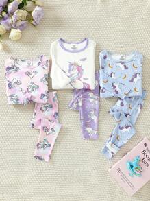 Eng anliegender Pyjama-Set für Baby Mädchen, Langarm T-Shirt und Leggings, mit niedlichem Einhorn Muster in lila, pink und blau Farben mit Regenbogen- und Sternenmotiven, erzeugt eine fröhliche und festliche Stimmung