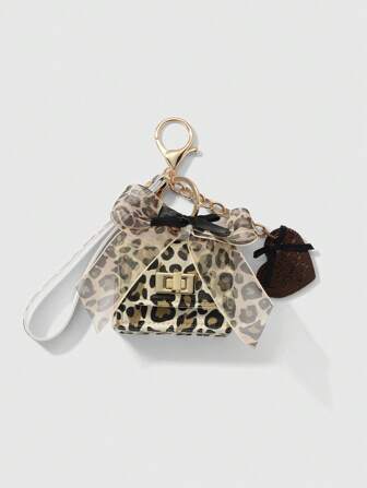 Kawaii 1 pièce Sac à monnaie, étui pour écouteurs, accessoire de porte-clés DIY avec nœud papillon en chaîne, style rétro de mode Y2K, impression léopard, ruban en maille de haute qualité. Modèle versatile et élégant, convient pour les femmes, l'usage quotidien et les cadeaux.
