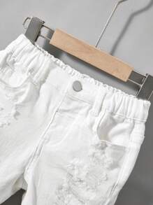 SHEIN Pantalones cortos de niño con diseño desgarrado de color liso