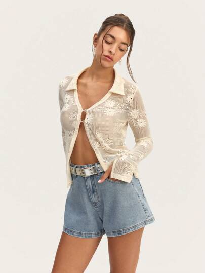 Nöista 透明长袖衬衫，纽扣闭合，表面有光泽，非常适合搭配吊带背心或高腰下装，打造精致外观。