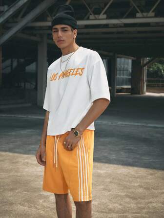 Manfinity RebelGame Set de 2 piezas de camiseta de manga corta holgada casual de punto y pantalón corto recto de cintura elástica para hombres