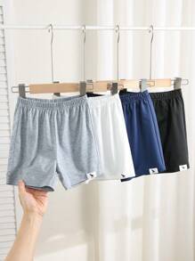 Set de 4 piezas de shorts cómodos, casuales y con estilo para niños, con decoración de insignia y cinturilla, aptos para uso diario, escuela, viajes y deportes en primavera y verano