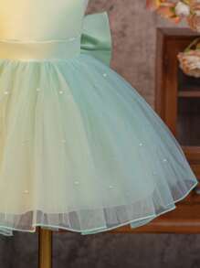 SHEIN Glamorique Kids Váy dự tiệc cưới Pageboy Flower Girl Dance Dress, Váy công chúa cho bé gái, Tay áo nhỏ bằng vải satin màu xanh lá cây làm cho nó dễ thương và vui tươi hơn. Viền váy đầy lưới ngọc trai màu trắng, và mặt sau của chiếc nơ lớn bằng vải satin có thể tháo rời hình chữ V may mắn phù hợp cho sinh nhật, khiêu vũ, đám cưới, lễ hội, những dịp trang trọng, biểu diễn piano trên sân khấu, người dẫn chương trình, tiệc tùng hoặc những dịp đặc biệt. Trang phục hàng ngày - màu xanh lá - Xem 6