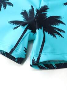 SHEIN Conjunto de traje de baño para niño preadolescente con top de manga larga tipo camiseta rashguard con estampado de palmeras y shorts de natación. Adecuado para usar en la piscina o en la playa.
