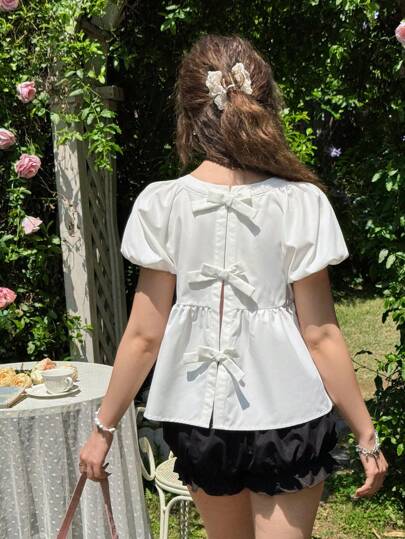 SHEIN Bộ 2 món/bộ áo sơ mi tay bồng và quần short họa tiết nơ giản dị rộng rãi cho bé gái tuổi teen