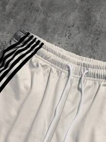 Manfinity Streetrush Pantalones deportivos holgados con cordón en la cintura, de rayas, versátiles para hombre