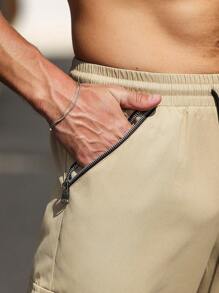Manfinity Homme Pantalones de hombre de unicolor con cordón y bolsillos con cremallera
