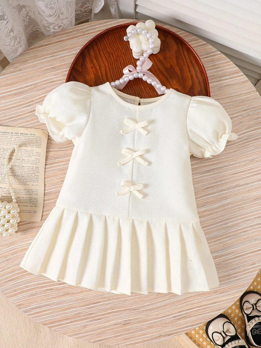 SHEIN Baby Girl White Dress With Bow Decor, Cute And Sweet, Pleated Hem For Fashionable Look, Elegant White Dress With Puff Sleeves, Suitable For Spring, Summer And Autumn, Great For Outing And Party - Apricot - View 1