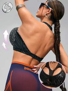 Innovista Biustonosz sportowy z nadrukiem foliowym dla kobiet, usztywniany top sportowy ze sztucznej skóry i metalicznego połysku, wycięty, oddychający, siateczkowy strój do ćwiczeń z wycięciami i elastyczną konstrukcją, top fitness. Nadruk z motywem wężowej panterki, awangardowy i unikatowy, elegancki i luksusowy dres, idealny na festiwal muzyczny, imprezę, taniec, ćwiczenia elektryczne, jogę, matę, pilates, bieganie, cardio, wyjścia, rekreację, ćwiczenia siłowe, ciężarki, czarny, Y2K, odzież na jesień, bikini, strój kąpielowy, prezent na Dzień Matki