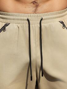Manfinity Homme Pantalones de hombre de unicolor con cordón y bolsillos con cremallera