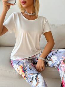 SHEIN Conjunto de pijama para dama con top de manga corta de unicolor y pantalón largo con estampado floral