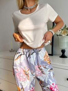 SHEIN Conjunto de pijama para dama con top de manga corta de unicolor y pantalón largo con estampado floral