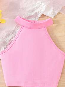 Set da 2 pezzi da ragazza pre-adolescente, composto da top con collo alatorie di colore tinta unita e gonna/shorts in rete ricamata con motivi floreali, adatto per l'estate