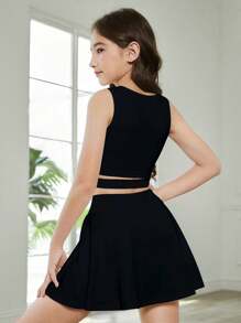 Conjunto de 2 piezas (chaleco deportivo y falda de tenis) para niñas preadolescentes, color negro sólido, minimalista y cómodo, versátil para primavera/verano, diseño deportivo con espalda de tirantes y falda de cintura alta con ajuste ceñido, tela elástica - Negro - Ver 2
