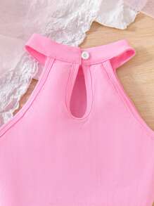 Set da 2 pezzi da ragazza pre-adolescente, composto da top con collo alatorie di colore tinta unita e gonna/shorts in rete ricamata con motivi floreali, adatto per l'estate