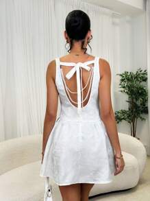 Glamine Vestido mini con volantes, sin mangas y sin espalda con decoración de perlas - Albaricoque - Ver 6