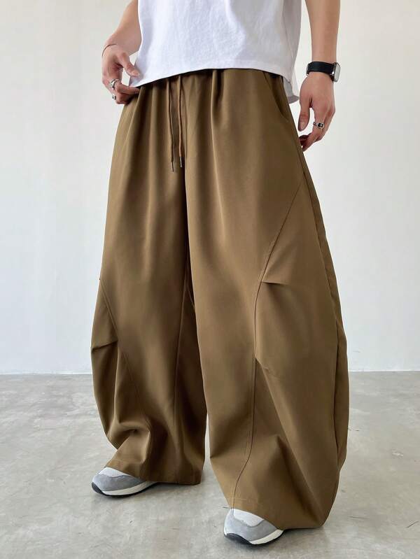 Manfinity Homme Pantalones casuales sueltos y holgados con pliegues y cintura con cordón para hombres de talla grande