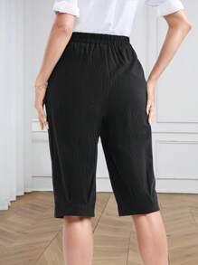 Miaspire Pantalones de verano/primavera casuales de largo medio para mujeres, con bolsillos con decoración de botones en tela negra, acortados