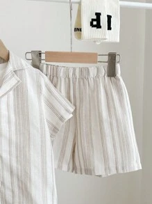 SHEIN 3pcs/Set Young Boy Casual Resort Beige Polo Collar Short Sleeve Cardigan, Elastic Waist Shorts And Plain White Comfortable Knit Short Sleeve T-Shirt, Textured Jacquard Fabric Suitable For Home, School, Travel And Vacation - Khaki - View 4