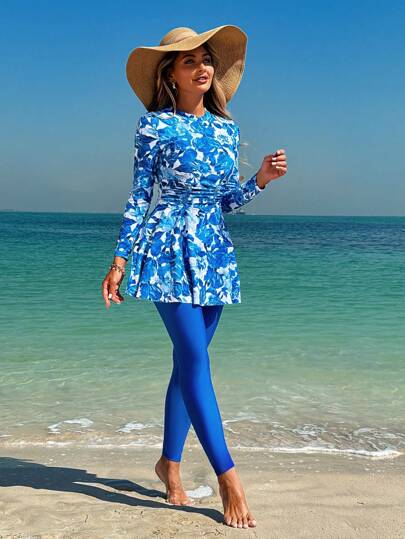 Swim Mulvari مجموعة ملابس سباحة نسائية تتكون من قطعتين، ملابس علوية ماكسي كاملة التغطية بأكمام طويلة وبطبعات زهور مع بنطال أحادي اللون بندقي