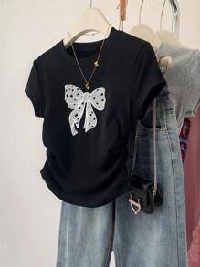 Camiseta de manga corta con lazo grande y estampado para niñas preadolescentes, versátil y casual