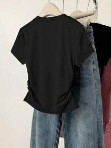 Camiseta de manga corta con lazo grande y estampado para niñas preadolescentes, versátil y casual