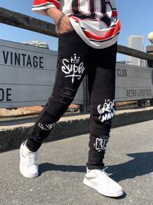 SHEIN 青少年男童时尚休闲 Y2k 白色涂鸦黑色牛仔修身不对称剪裁弹力紧身牛仔裤，适合儿童穿着，柔软舒适，适合日常穿着，也适合儿童春夏穿着。