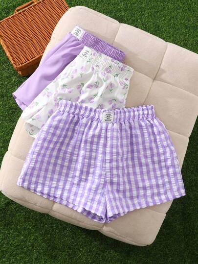 SHEIN Promoción: compra 1 y llévate 2 gratis/set. Shorts informales para el hogar de primavera y verano, de tejido con logotipo, con cinturilla elástica detallada, en unicolor morado, cuadros morados y estampado de tulipanes