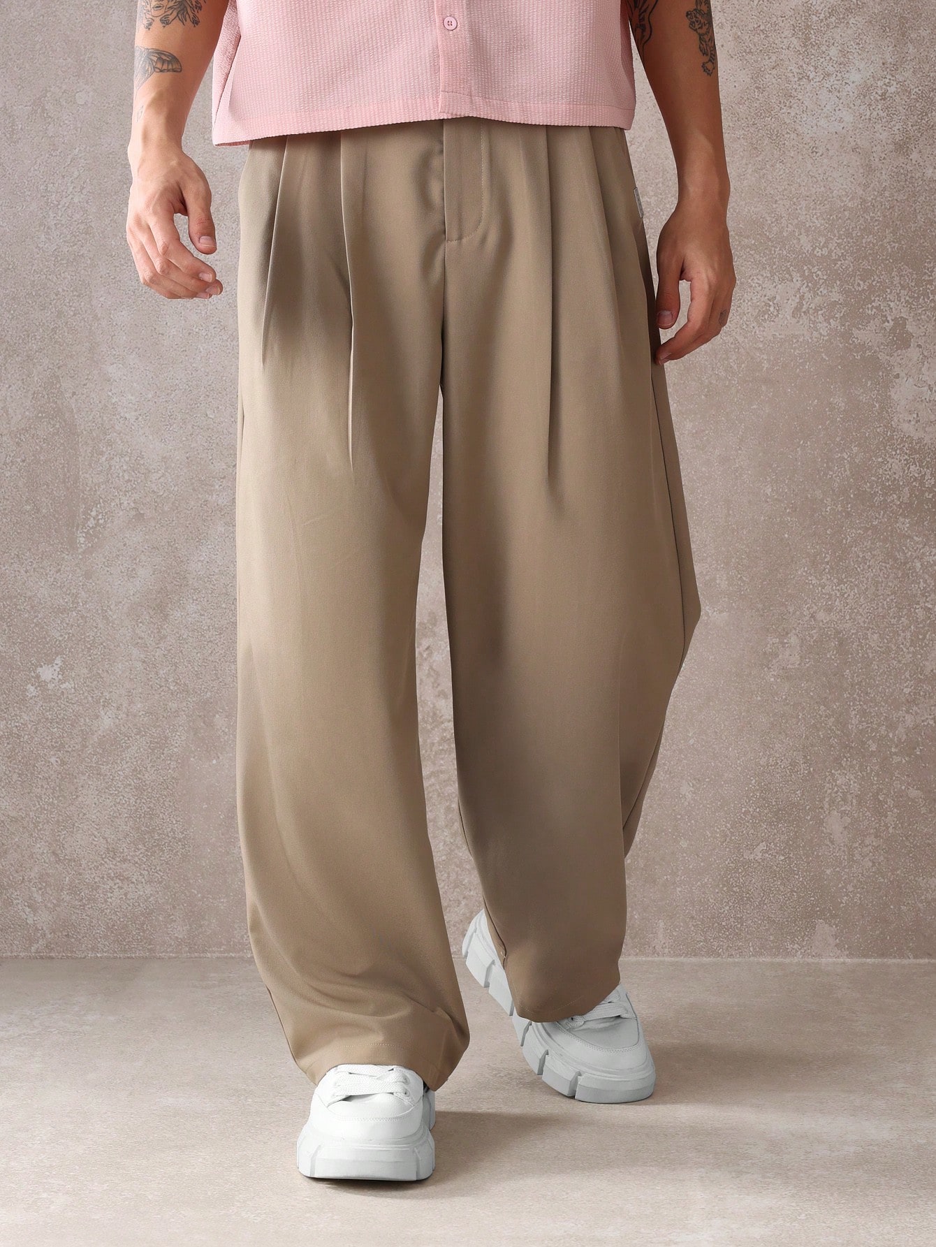 Pantalon élégant à jambes larges et décontractées avec doubles plis
