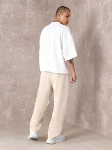 SUMWON Pantalón de chándal premium con pretina caída, números de equipo y detalles, cómodo ajuste para hacer ejercicio y uso casual en todas las estaciones