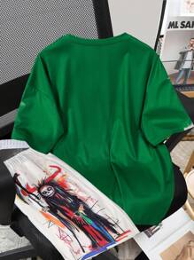 Manfinity EMRG Painting Print Casual Men T-Shirt Set,Men's Mature And Casual Loose Short-Sleeved T-Shirt Set, With Contrasting Green And Apricot Colors On The Top And Bottom, And Personalized Patterns On The Chest And Shorts, Full Of Fashion Sense. The Overall Style Is Avant-Garde And Bold, Showing A Unique Street Fashion Atmosphere, Suitable For Outdoor Sports And Leisure Occasions.