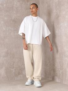 SUMWON Pantalón de chándal premium con pretina caída, números de equipo y detalles, cómodo ajuste para hacer ejercicio y uso casual en todas las estaciones