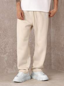 SUMWON Pantalón de chándal premium con pretina caída, números de equipo y detalles, cómodo ajuste para hacer ejercicio y uso casual en todas las estaciones