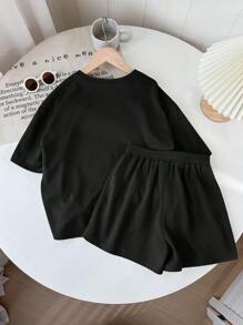 SHEIN LMoss Kids LMoss Tween Girl Music Festival Woven Solid Color Round Neck Short Sleeve T-Shirt And Shorts Set